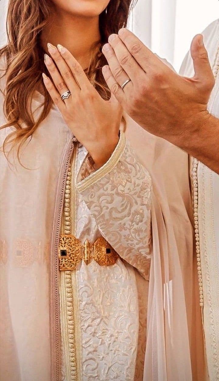 Moroccan wedding rings and caftan detail